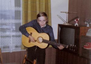 Tom and his first guitar 1973     